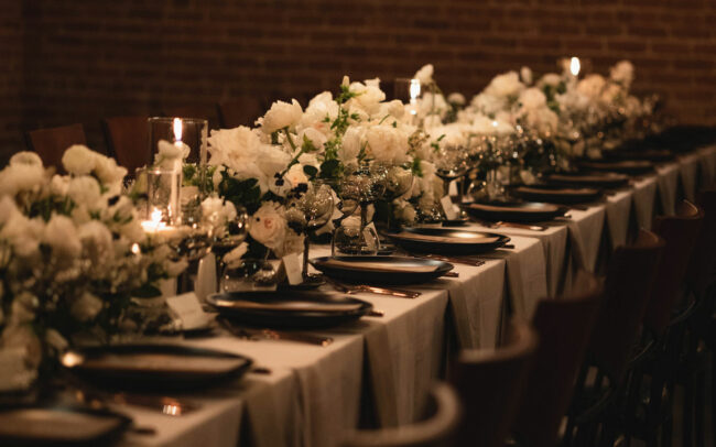 Long table set with flowers in the center
