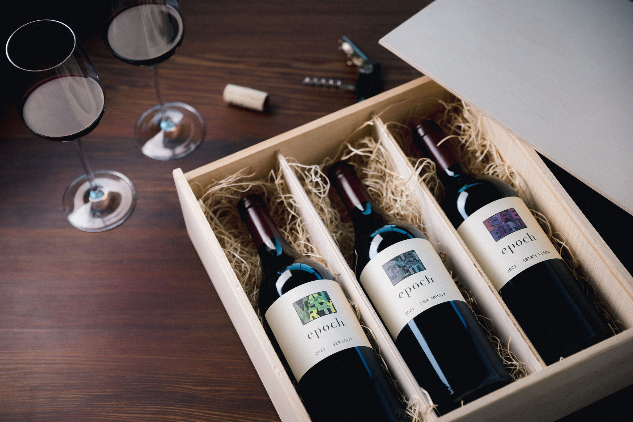 Wooden box with three bottles of Epoch wines inside